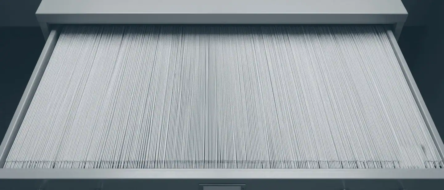 Abstract overhead view of an open archive drawer