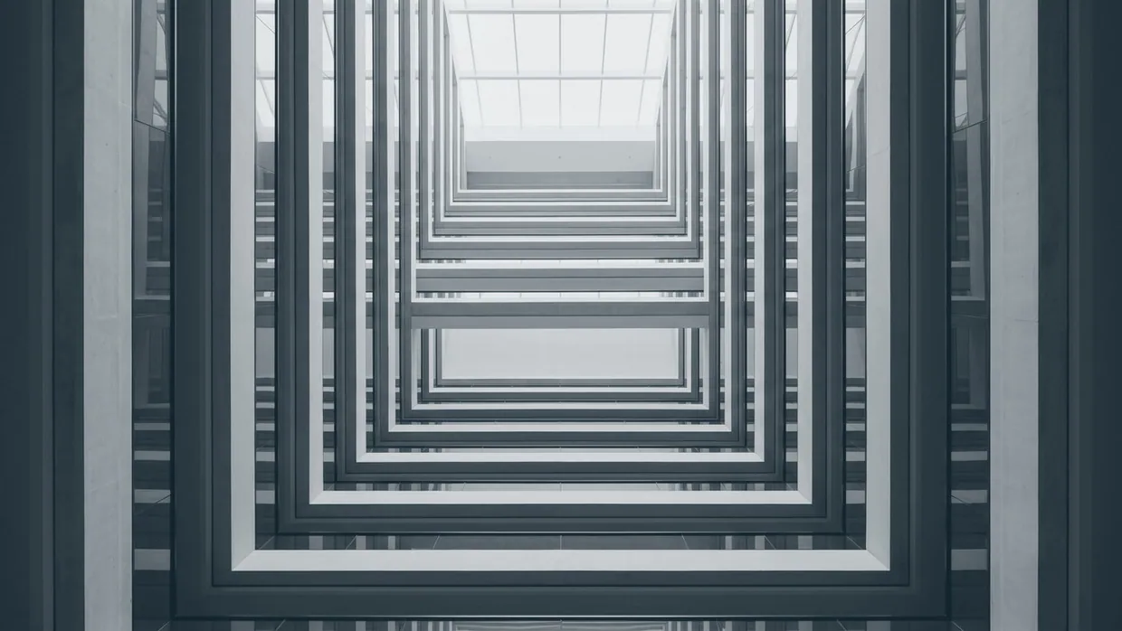 Abstract view upward through a stacked atrium