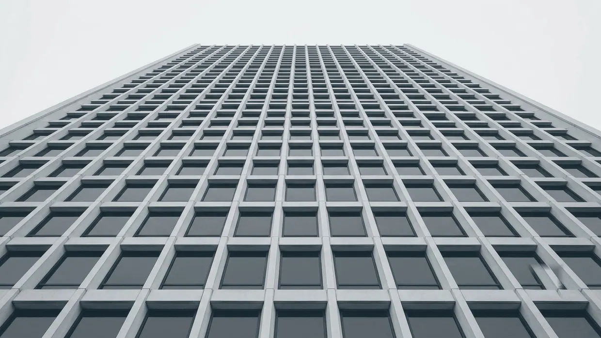 Abstract upward view of a modern building facade grid
